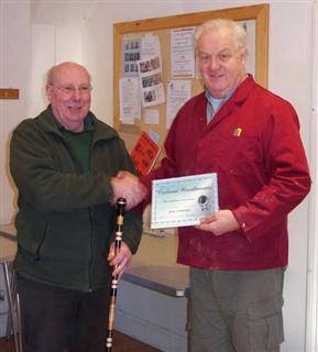 Pat Hughes receives the highly commended certificate from Chris Eagles